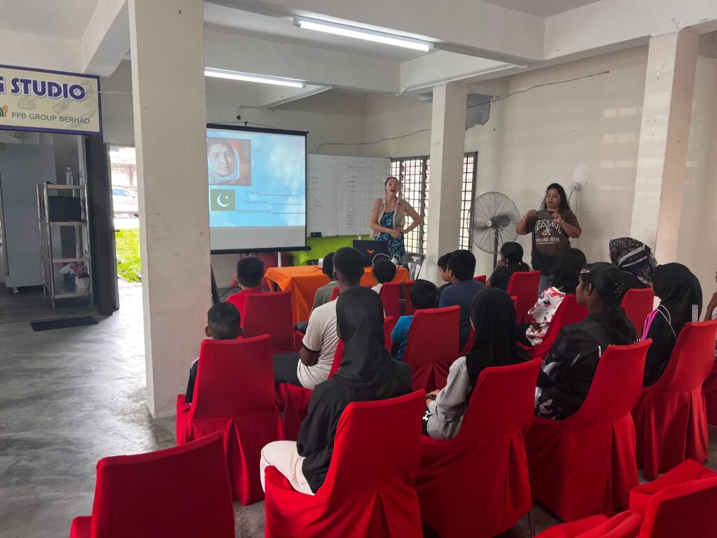 Children participating in a human rights workshop in Southeast Asia, learning about justice and equality.